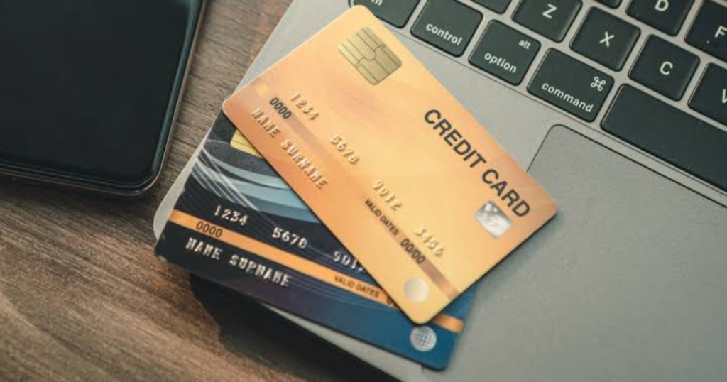 Credit card vs debit card side by side on a desk