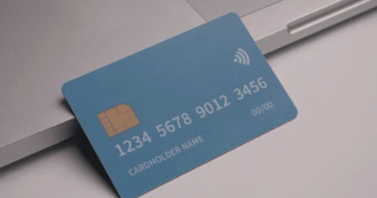 Credit card vs debit card side by side on a desk
