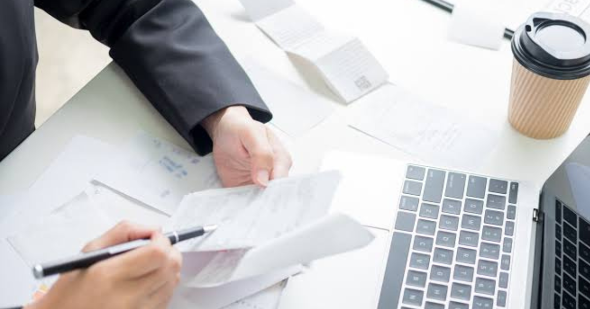 Person budgeting while feeling stressed about checking their bank account