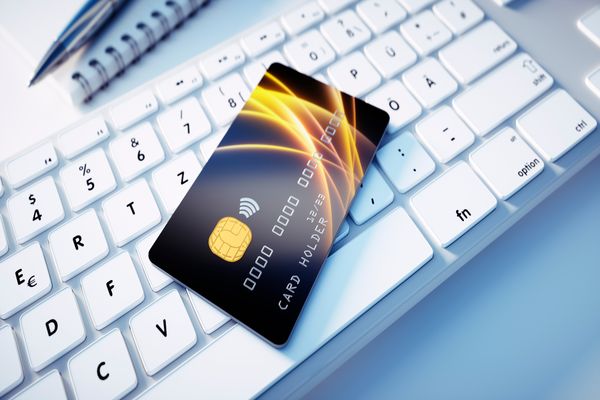 Credit card vs debit card side by side on a desk