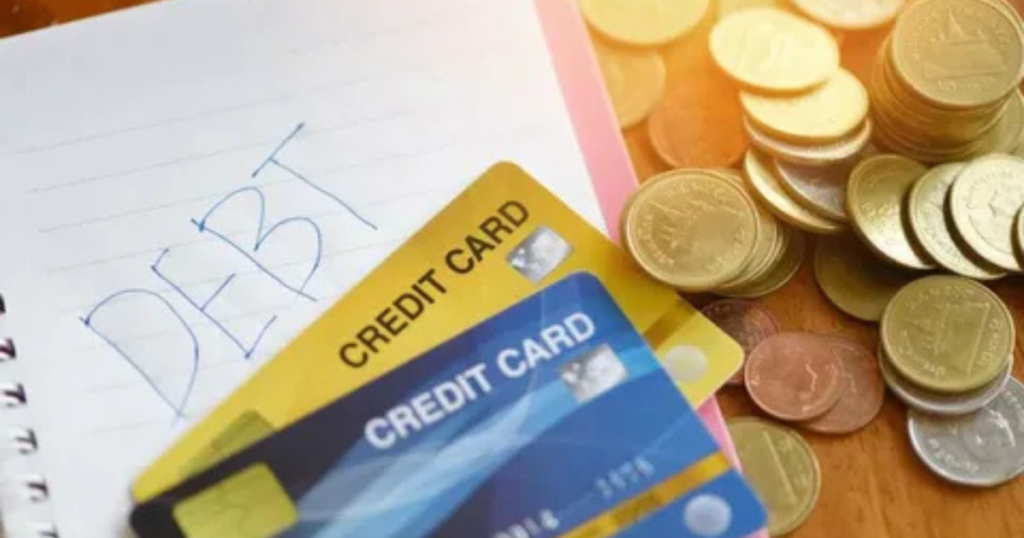 An illustration comparing a blue debit card paying a POS terminal versus a gold credit card at an ATM in the UK.